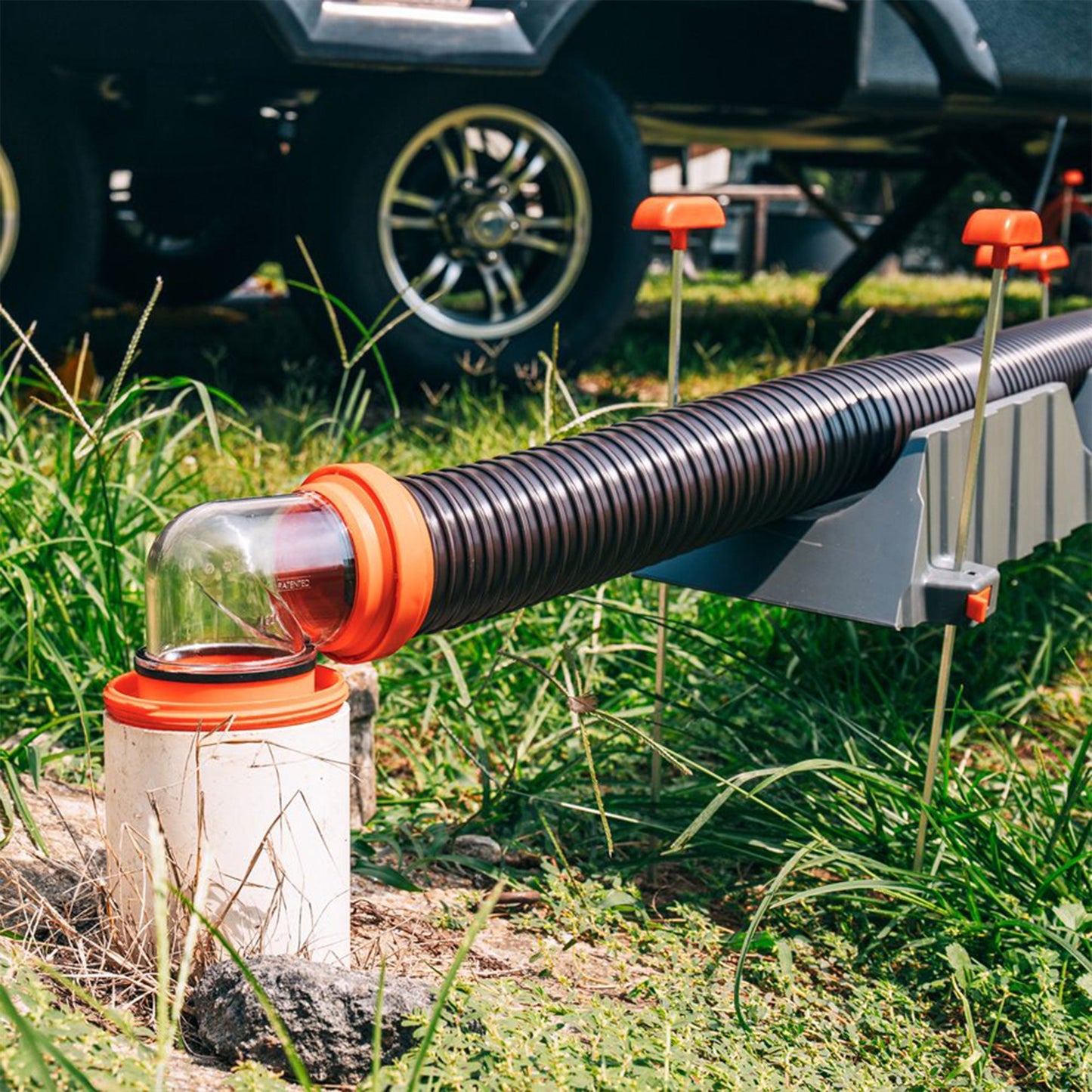 Camco RhinoFLEX 20’ RV Sewer Hose Kit w/ Removable 4 in 1 Adapter, Black/Orange