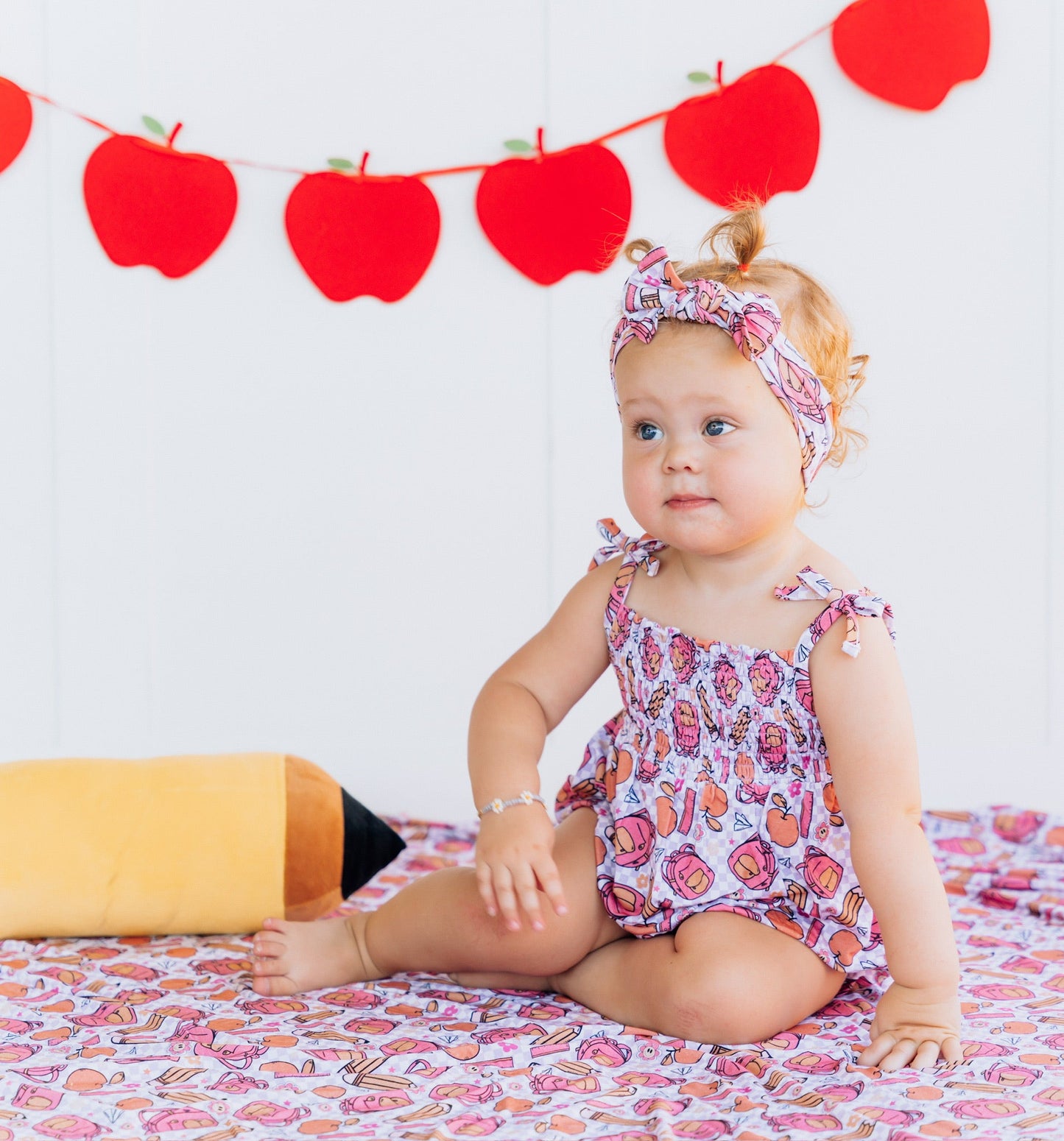 RULE THE SCHOOL SMOCKED BUBBLE ROMPER