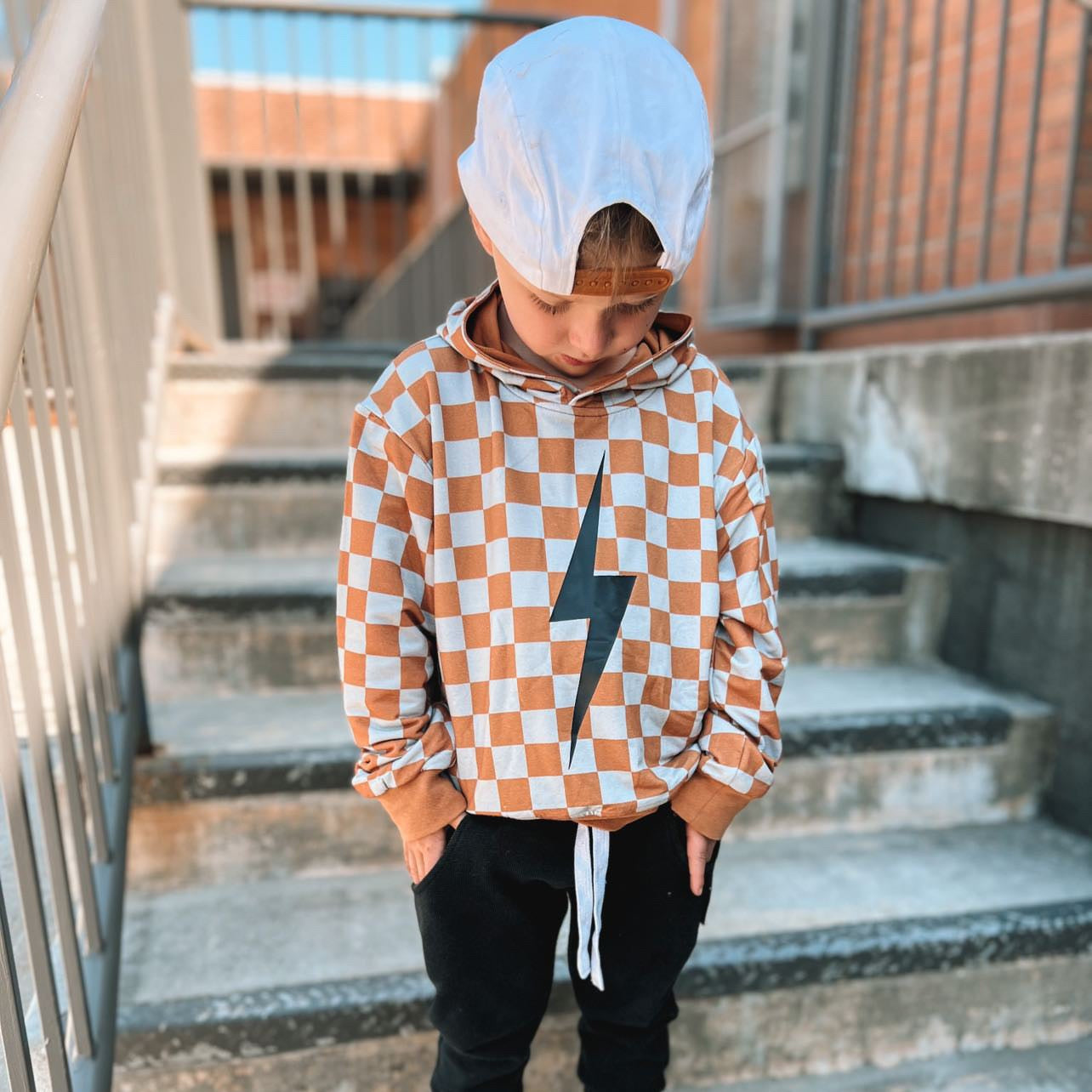 THE CHECKERED SPARK HOODIE - RUST