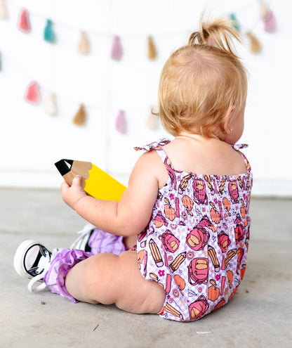 RULE THE SCHOOL SMOCKED BUBBLE ROMPER