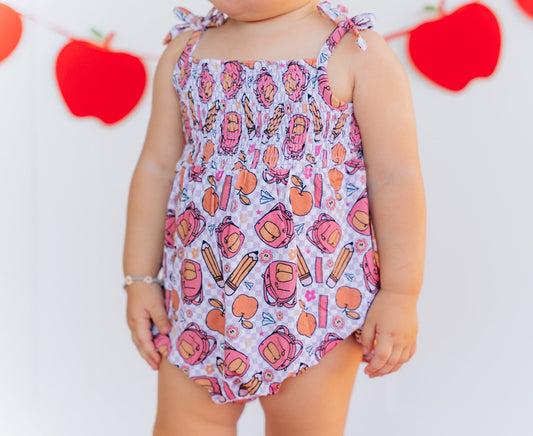 RULE THE SCHOOL SMOCKED BUBBLE ROMPER