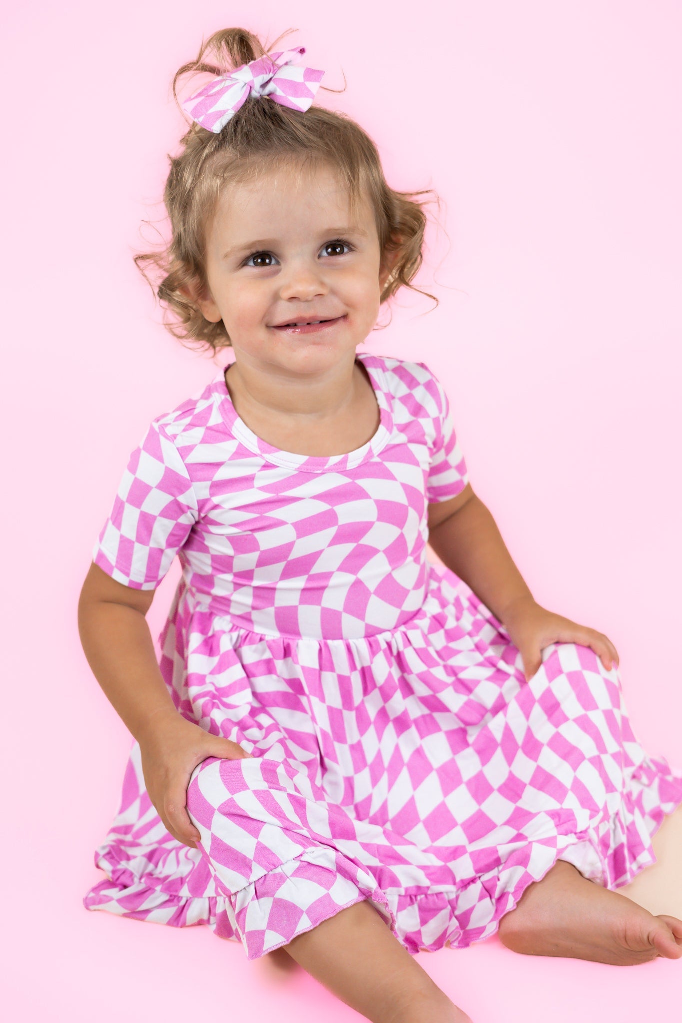 BUBBLEGUM WAVY CHECKERS DREAM RUFFLE DRESS