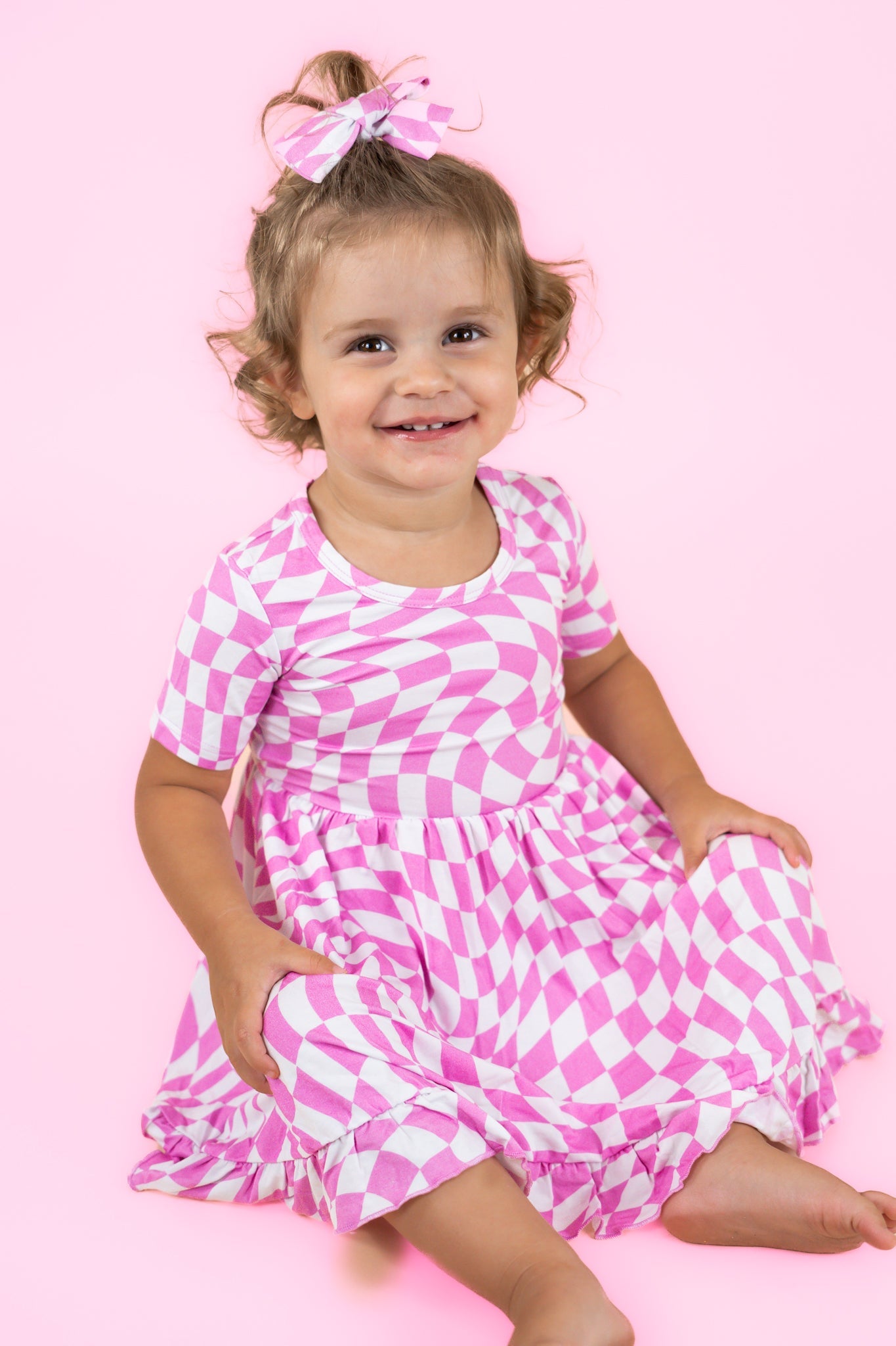 BUBBLEGUM WAVY CHECKERS DREAM RUFFLE DRESS