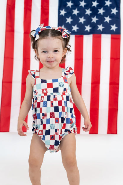 HOME OF THE FREE CHECKERS DREAM BUBBLE ROMPER