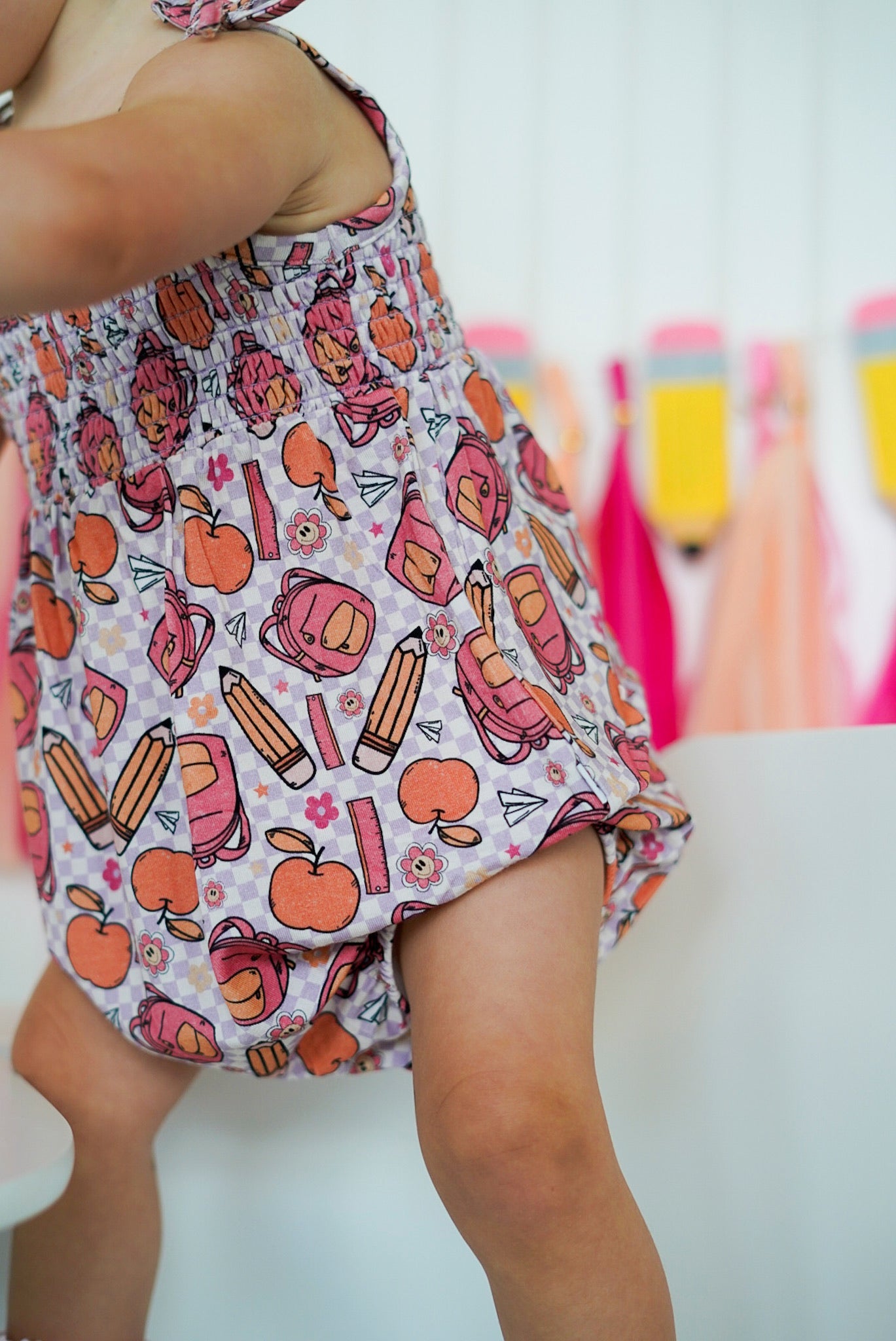 RULE THE SCHOOL SMOCKED BUBBLE ROMPER