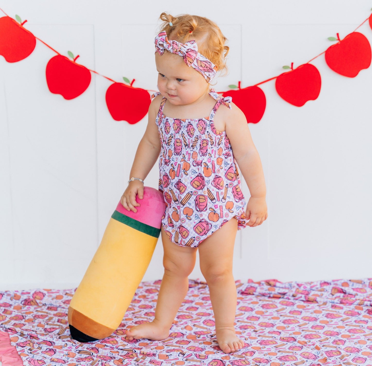 RULE THE SCHOOL SMOCKED BUBBLE ROMPER