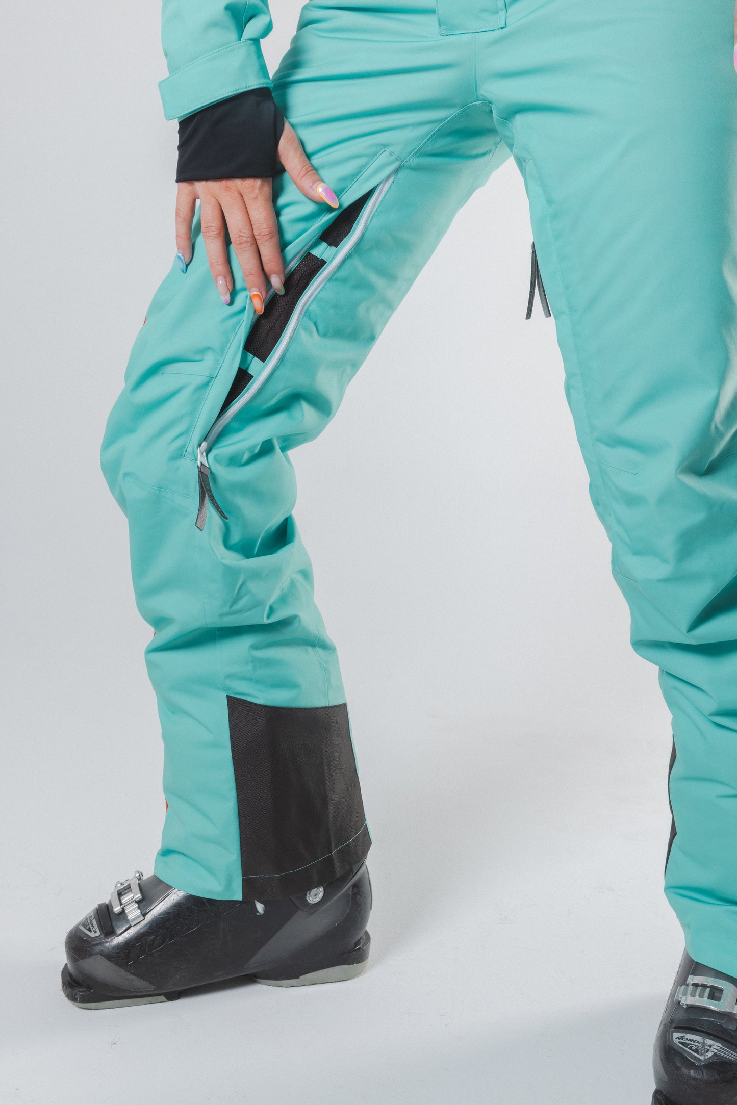 The Midday Aprés | Teal and Orange Retro Stripe Women's One Piece Ski Suit