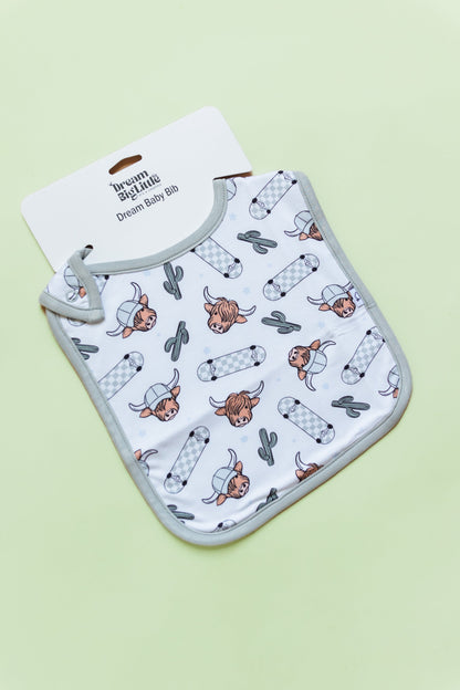 EXCLUSIVE MOO-VING FAST DREAM BABY BIB